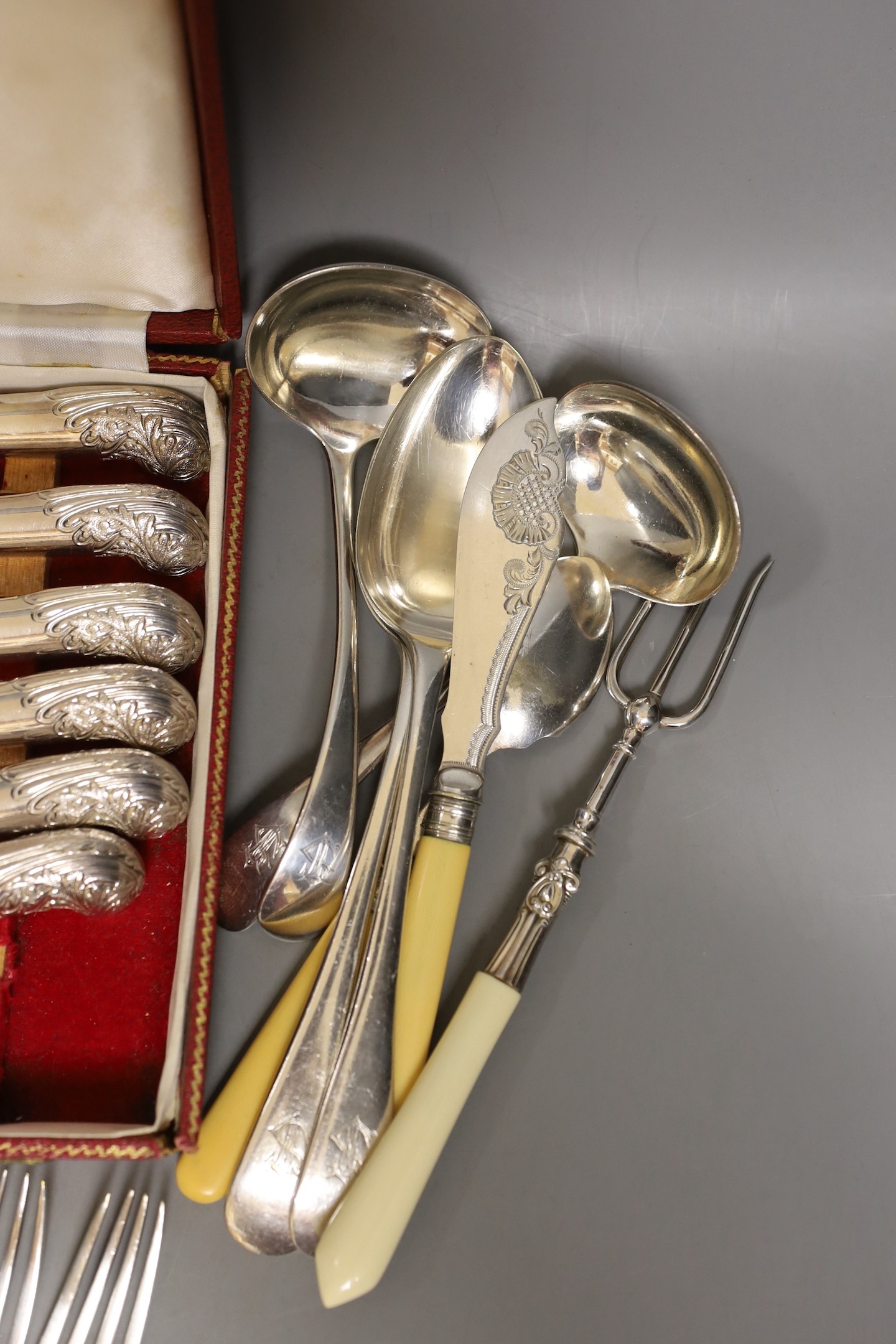 A cased set Garrard pistol handled steak knives, other plated cutlery and a plated mug